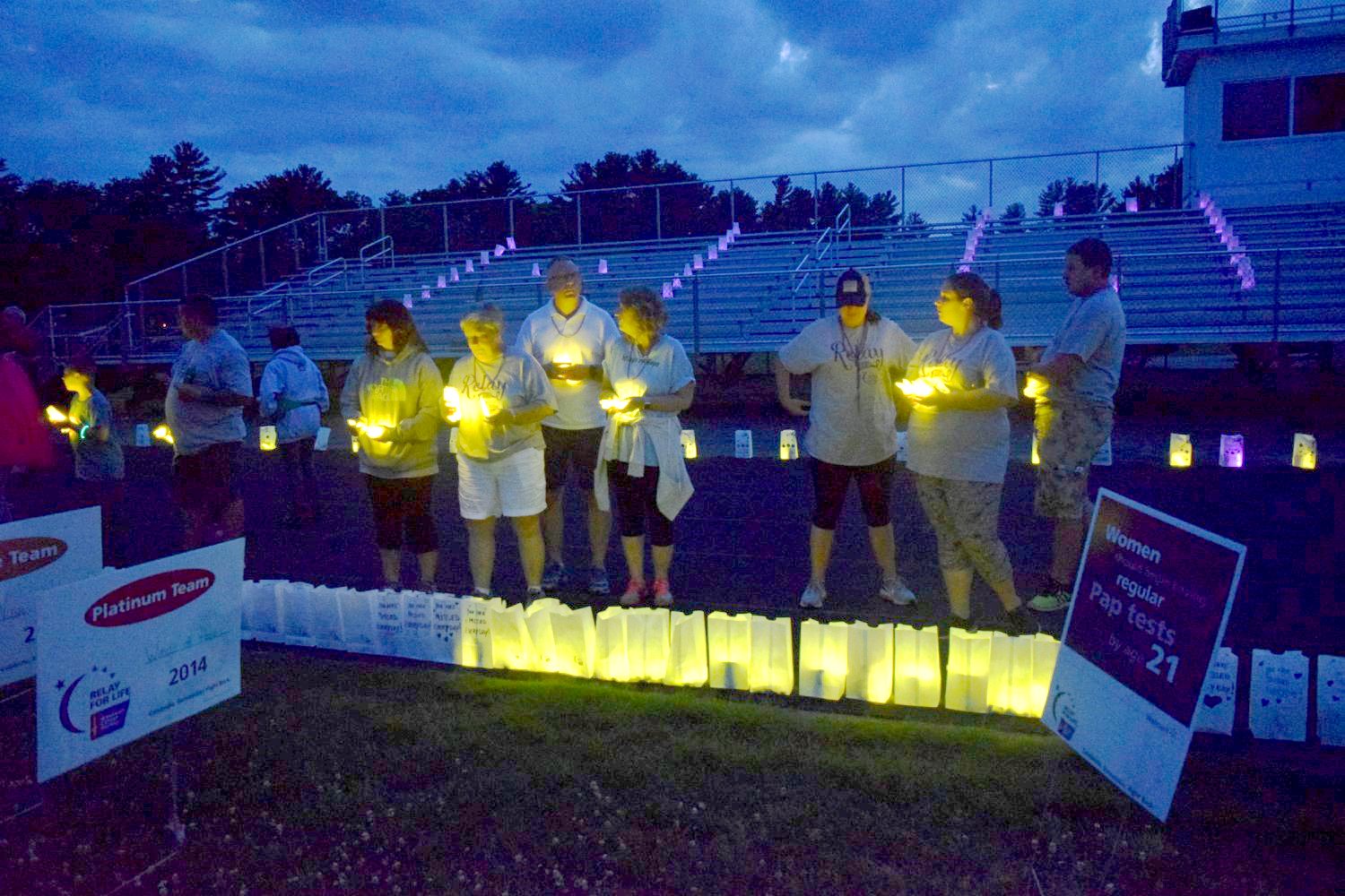 Luminaria, shown at a past Relay For Life of Greater Attleboro event, are typically lit around a track in honor of cancer survivors and in memory of cancer victims.